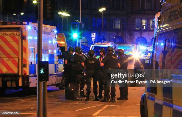 Armed police at Manchester Arena after reports of an explosion at the venue during an Ariana Grande gig.