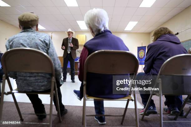 Democratic U.S. Congressional candidate Rob Quist talks with supporters during a Get Out The Vote Canvass Launch event at Labor Temple on May 22,...