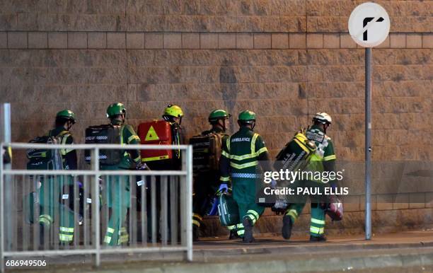 Medics and rescuers in Manchester, Britain, deploy May 22 after reports of an explosion at the Manchester Arena. British police said early May 23...