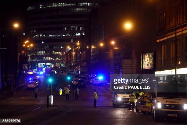 Police deploy at scene of explosion in Manchester, England, on May 23, 2017 at a concert. British police said early May 23 there were "a number of...