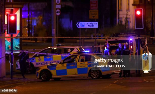 Police deploy at scene of explosion in Manchester, England, on May 23, 2017 at a concert. British police said early May 23 there were "a number of...