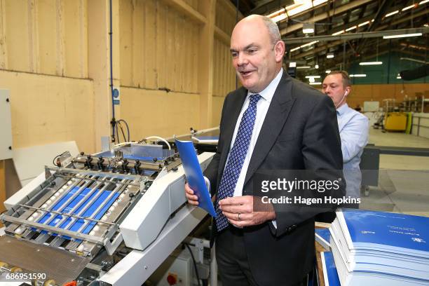 Finance Minister Steven Joyce watches the printing of the budget at Printlink on May 23, 2017 in Wellington, New Zealand. Joyce will deliver his...