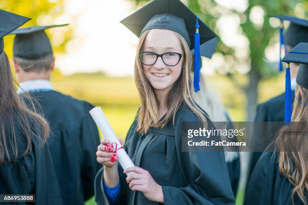 happy graduate - secondary school certificate stock pictures, royalty-free photos & images