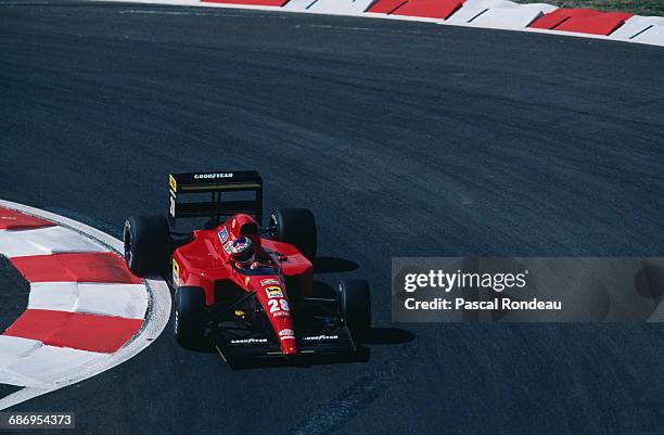Jean Alesi of France drives the Scuderia Ferrari SpA Ferrari 643 Ferrari V12 during practice for the French Grand Prix on 6 July 1991 at the Circuit...