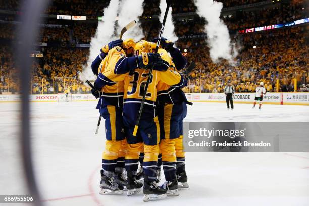 Austin Watson of the Nashville Predators celebrates his goal against the Anaheim Ducks with teammates during the first period in Game Six of the...