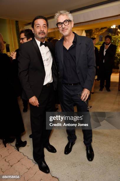 Antonio Urrutia and Alfonso Cuaron attend Fondazione Prada Private Dinner during the 70th annual Cannes Film Festival at Restaurant Fred L'Ecailler...