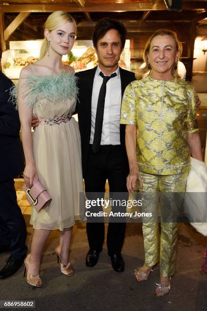 Elle Fanning, Gael Garcia Bernal and Miuccia Prada attend Fondazione Prada Private Dinner during the 70th annual Cannes Film Festival at Restaurant...