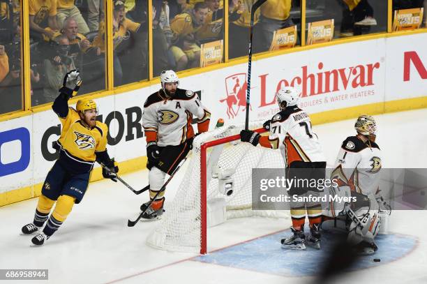 Colin Wilson of the Nashville Predators celebrates a goal by Austin Watson against Brandon Montour of the Anaheim Ducks during the first period in...