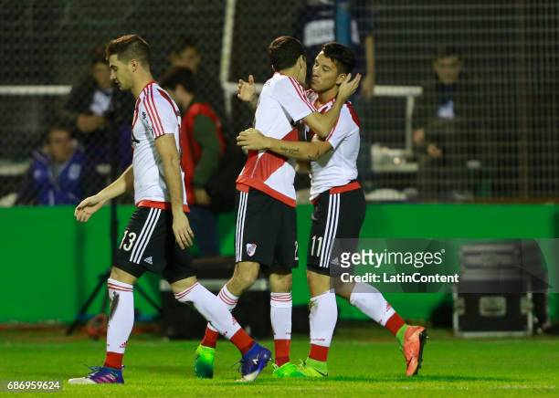 Sebastian Driussi of River Plate celebrates with teammates Lucas Alario and Camilo Mayada after scoring the first goal of his team during a match...