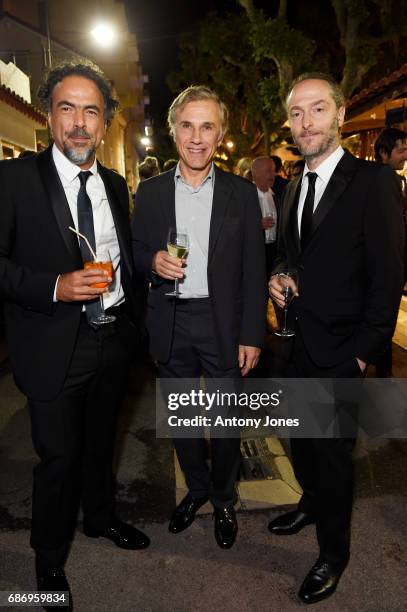 Alejandro Gonzalez Inarritu, Christoph Waltz and Emmanuel Lubezki attend Fondazione Prada Private Dinner during the 70th annual Cannes Film Festival...