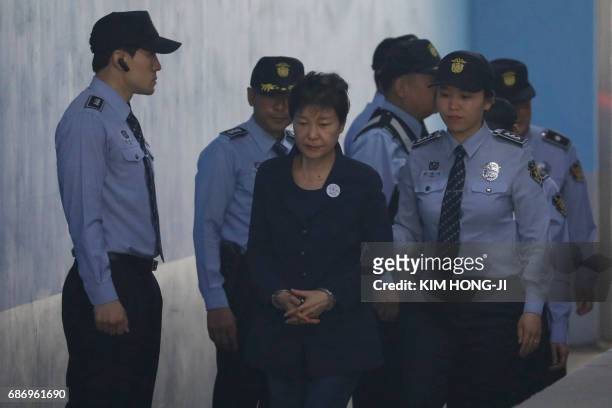 South Korean ousted leader Park Geun-hye arrives at a court in Seoul on May 23, 2017. Park Geun-Hye was due in court on May 23 to face trial over the...