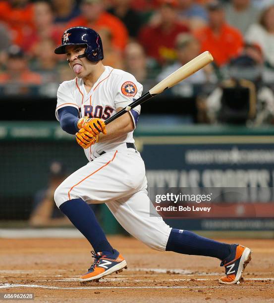 Jose Altuve of the Houston Astros doubles in a run in the first inning against the Detroit Tigers at Minute Maid Park on May 22, 2017 in Houston,...