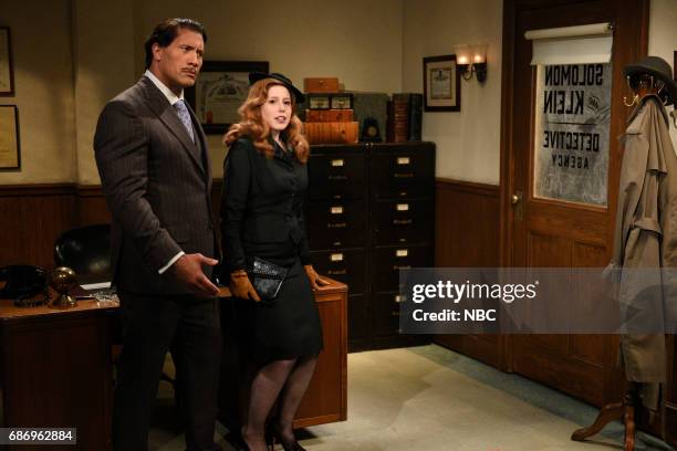 Dwayne Johnson" Episode 1725 -- Pictured: Dwayne Johnson as Brock Tenderson, Vanessa Bayer as Janet Charmpagne/Mrs. Carmichael during "RKO Movie Set"...