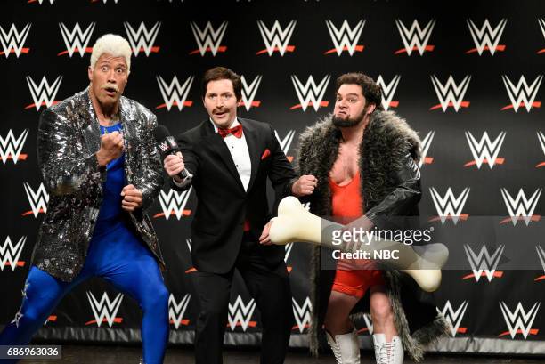 Dwayne Johnson" Episode 1725 -- Pictured: Dwayne Johnson as Koko WatchOut, Beck Bennett as an announcer, Bobby Moynihan as Trashyard Mutt during "WWE...