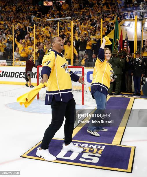 Former Tennessee Titans Eddie George and country music artist Trisha Yearwood rev up the fans prior to Game Six of the Western Conference Final...