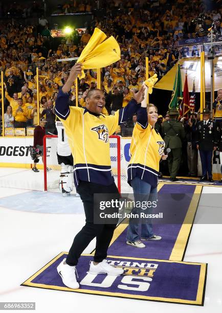 Former Tennessee Titans Eddie George and country music artist Trisha Yearwood rev up the fans prior to Game Six of the Western Conference Final...