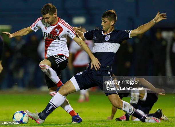 Lucas Alario of River Plate fights for the ball with Manuel Guanini of Gimnasia y Esgrima during a match between Gimnasia y Esgrima La Plata and...