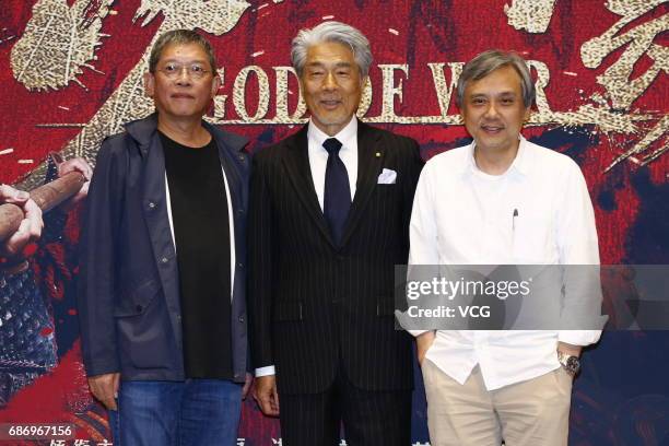 Japanese actor Yasuaki Kurata and director Gordon Chan attend the premiere of film "God of War" on May 22, 2017 in Beijing, China.