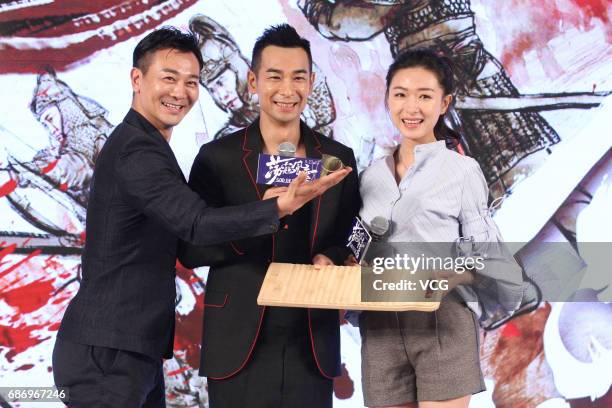 Actor Wu Yue, actor Vincent Zhao Wenzhuo and actress Wan Qian attend the premiere of film "God of War" on May 22, 2017 in Beijing, China.