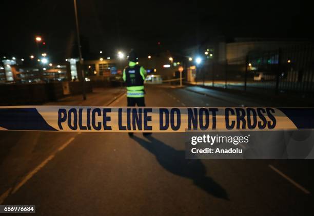 British police guard the entrance to the Manchester Arena stadium in Manchester, United Kingdom on May 23, 2017. A large explosion was reported...