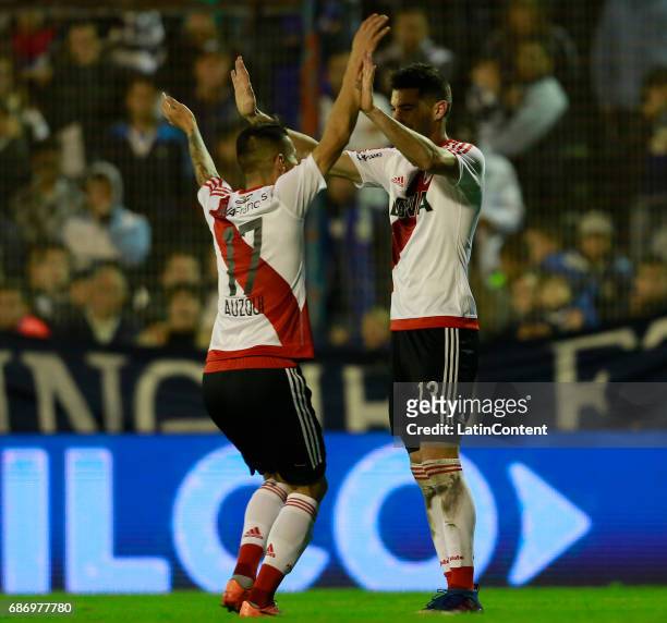Carlos Auzqui of River Plate celebrates with teammate Lucas Alario after scoring the third goal of his team during a match between Gimnasia y Esgrima...