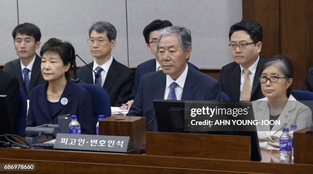 Former South Korean President Park Geun-hye and her longtime friend Choi Soon-sil attend the trial at the Seoul Central District Court in Seoul on...