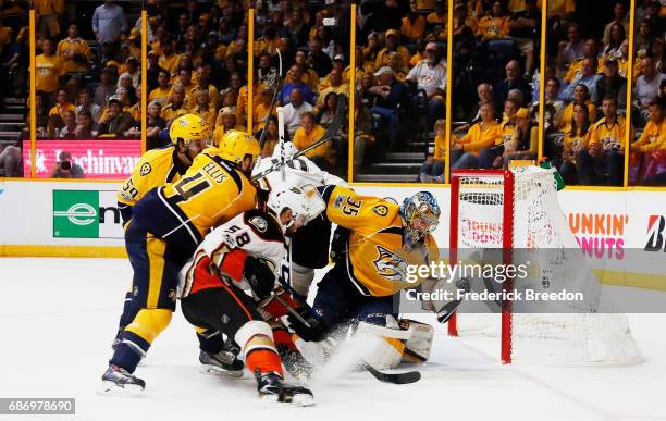 Pekka Rinne of the Nashville Predators defends against Nic Kerdiles of the Anaheim Ducks during the second period in Game Six of the Western...