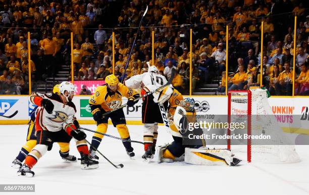 Pekka Rinne of the Nashville Predators defends against Nic Kerdiles of the Anaheim Ducks during the second period in Game Six of the Western...