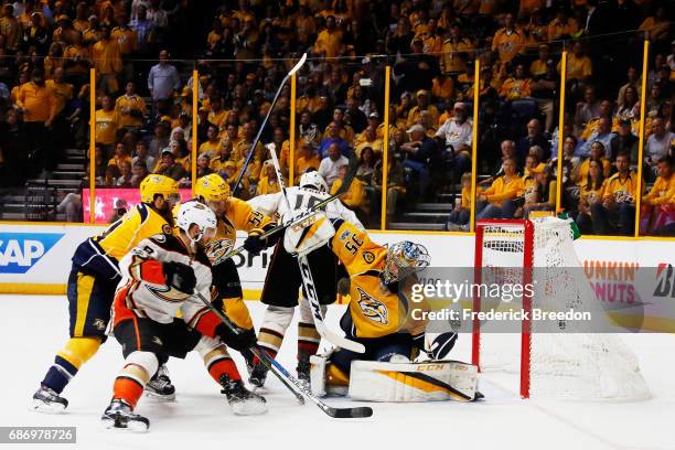 Pekka Rinne of the Nashville Predators defends against Nic Kerdiles of the Anaheim Ducks during the second period in Game Six of the Western...