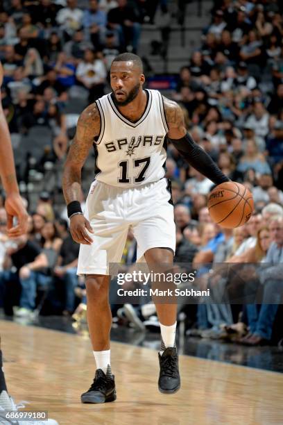 Jonathon Simmons of the San Antonio Spurs handles the ball against the Golden State Warriors during Game Four of the Western Conference Finals of the...