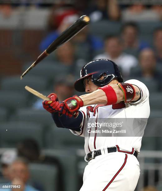 Catcher Tyler Flowers of the Atlanta Braves breaks his bat hitting a single in the second inning during the game against the Pittsburgh Pirates at...