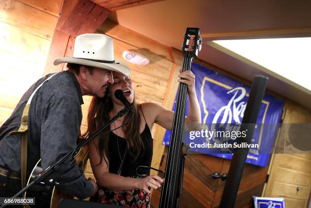 Democratic U.S. Congressional candidate Rob Quist performs a song with his daughter Halladay Quist during a gathering with supporters at Darkhorse...