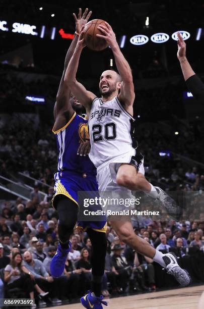 Manu Ginobili of the San Antonio Spurs drives to the basket against Draymond Green of the Golden State Warriors in the second half during Game Four...
