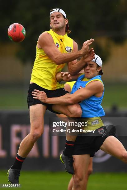 Josh Bruce of the Saints collides with Jack Steele during a St Kilda Saints AFL training session at Linen House Oval on May 23, 2017 in Melbourne,...