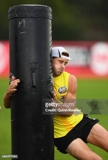 Josh Bruce of the Saints tackles the bag during a St Kilda Saints AFL training session at Linen House Oval on May 23, 2017 in Melbourne, Australia.