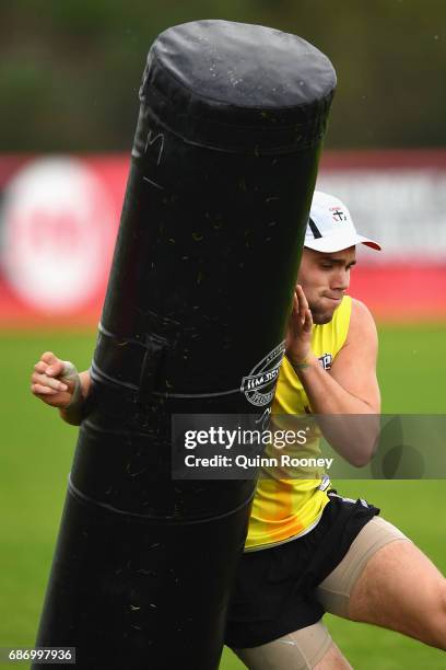 Paddy McCartin of the Saints tackles the bag during a St Kilda Saints AFL training session at Linen House Oval on May 23, 2017 in Melbourne,...