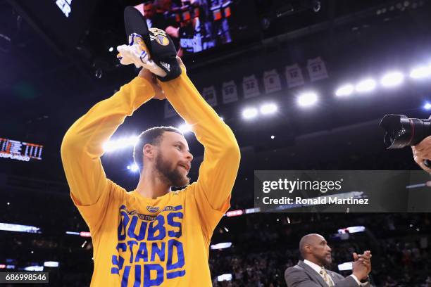 Stephen Curry of the Golden State Warriors celebrates after defeating the San Antonio Spurs 129-115 in Game Four of the 2017 NBA Western Conference...