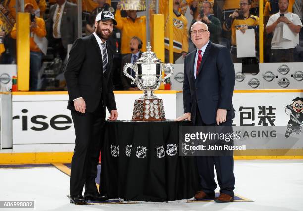 Deputy Commissioner Bill Daly presents Mike Fisher of the Nashville Predators with the Clarence S. Campbell trophy as Western Conference Champions...