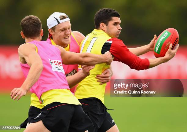 Leigh Montagna of the Saints is tackled by Hugh Goddard during a St Kilda Saints AFL training session at Linen House Oval on May 23, 2017 in...