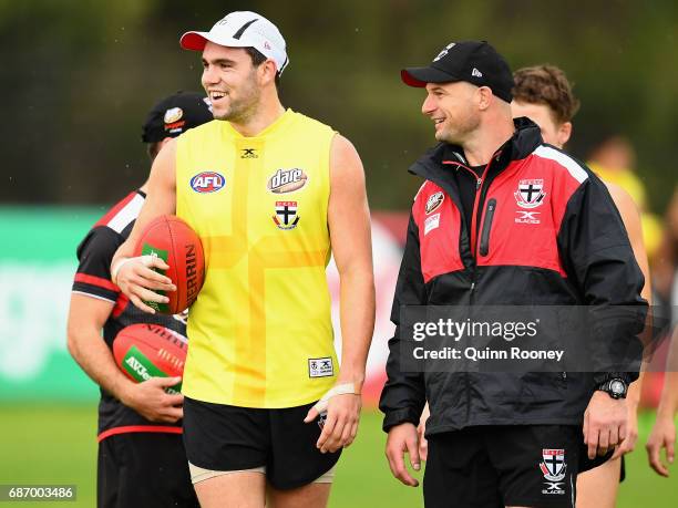 Paddy McCartin of the Saints talks to Aaron Hamill during a St Kilda Saints AFL training session at Linen House Oval on May 23, 2017 in Melbourne,...