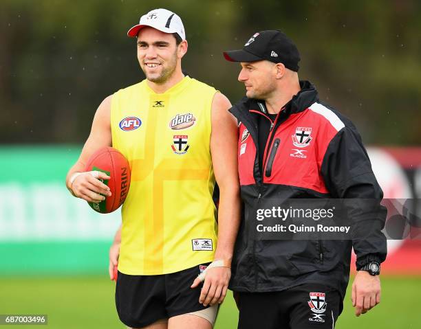 Paddy McCartin of the Saints talks to Aaron Hamill during a St Kilda Saints AFL training session at Linen House Oval on May 23, 2017 in Melbourne,...