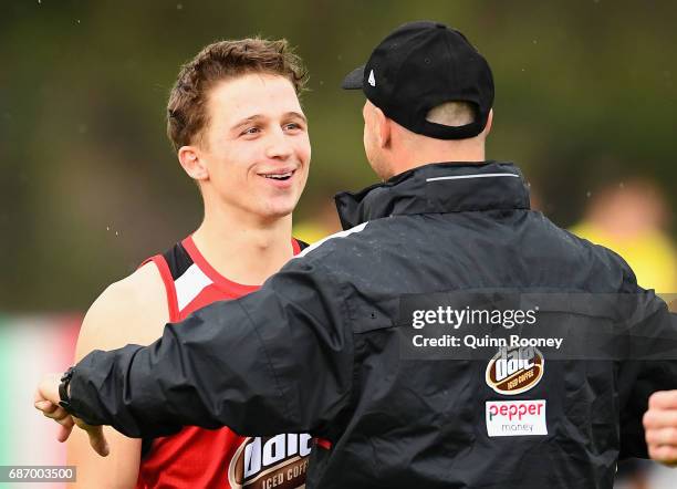 Jack Billings of the Saints talks to Aaron Hamill during a St Kilda Saints AFL training session at Linen House Oval on May 23, 2017 in Melbourne,...