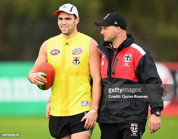 Paddy McCartin of the Saints talks to Aaron Hamill during a St Kilda Saints AFL training session at Linen House Oval on May 23, 2017 in Melbourne,...