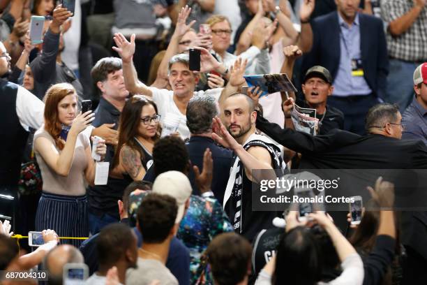 Manu Ginobili of the San Antonio Spurs waves as he leaves the court after the Golden State Warriors defeated the San Antonio Spurs 129-115 in Game...