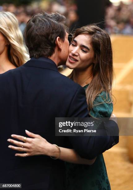 Tom Cruise greets Sofia Boutella during a photo call for The Mummy at World Square on May 23, 2017 in Sydney, Australia.