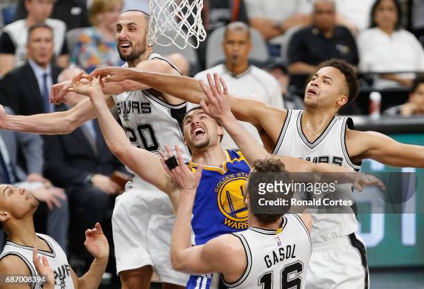 Klay Thompson of the Golden State Warriors drives to the basket against Manu Ginobili, Kyle Anderson and Pau Gasol of the San Antonio Spurs in the...