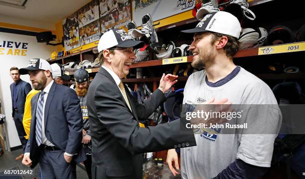 General Manager David Poile congratulates Roman Josi of the Nashville Predators after a 6-3 series win against the Anaheim Ducks in Game Six of the...