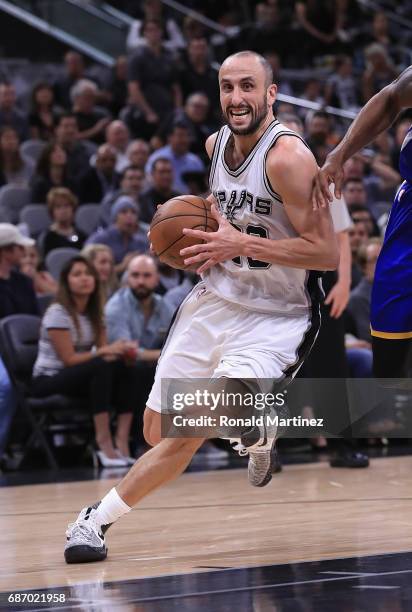 Manu Ginobili of the San Antonio Spurs dribbles the ball in the second half against the Golden State Warriors during Game Four of the 2017 NBA...