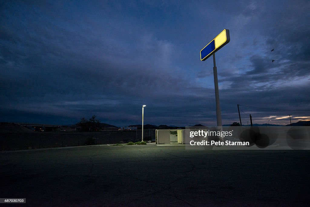 Alley/parking lot behind remote gas station.