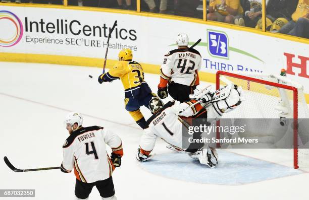 Jonathan Bernier of the Anaheim Ducks defends against Viktor Arvidsson of the Nashville Predators during the second period in Game Six of the Western...